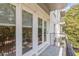 Condo balcony overlooking a landscaped area with mature trees at 3201 Lenox Ne Rd # 23, Atlanta, GA 30324