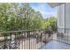Spacious balcony overlooking mature trees and neighborhood parking at 3201 Lenox Ne Rd # 23, Atlanta, GA 30324