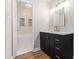 Updated bathroom featuring vanity with sink, drawers, and a tub with white tile at 3201 Lenox Ne Rd # 23, Atlanta, GA 30324