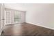 Neutral bedroom with hardwood floors, white trim, and a window with a view at 3201 Lenox Ne Rd # 23, Atlanta, GA 30324