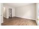 Bedroom view showcasing hardwood floors, closet, and an abundance of light at 3201 Lenox Ne Rd # 23, Atlanta, GA 30324