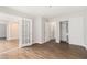 Bright bedroom showcases hardwood floors, closet, and view into adjacent room at 3201 Lenox Ne Rd # 23, Atlanta, GA 30324