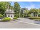 Elegant gated entrance to The James Condominiums with meticulous landscaping and a welcoming, secure environment at 3201 Lenox Ne Rd # 23, Atlanta, GA 30324