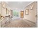 Hallway with patterned carpeting leading to an elevator and balcony at 3201 Lenox Ne Rd # 23, Atlanta, GA 30324
