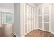 Bright hallway featuring hardwood floors and a closet with panel doors at 3201 Lenox Ne Rd # 23, Atlanta, GA 30324