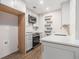 Efficient kitchen showcasing stainless steel appliances, white cabinetry, and wooden floors at 3201 Lenox Ne Rd # 23, Atlanta, GA 30324