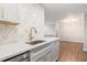 Contemporary kitchen features a stylish faucet, white quartz countertop and subway tile at 3201 Lenox Ne Rd # 23, Atlanta, GA 30324
