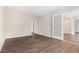 Bright living room features neutral paint, hardwood floors, and a doorway at 3201 Lenox Ne Rd # 23, Atlanta, GA 30324