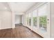 Bright living room boasts hardwood floors, balcony access, and white trim at 3201 Lenox Ne Rd # 23, Atlanta, GA 30324