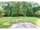 Lush backyard featuring well-maintained lawn and playground at 40 Queensland Ln, Covington, GA 30016
