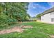 Expansive backyard featuring mature trees and a playground at 40 Queensland Ln, Covington, GA 30016