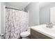 Bathroom featuring a modern vanity and shower with decorative curtain at 40 Queensland Ln, Covington, GA 30016