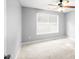 Bright bedroom with a large window and neutral carpet at 40 Queensland Ln, Covington, GA 30016
