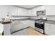Bright kitchen with sleek stainless steel appliances, ample counter space, and modern white cabinetry at 40 Queensland Ln, Covington, GA 30016