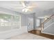 Bright living area with wainscoting and views of the foyer and staircase at 40 Queensland Ln, Covington, GA 30016