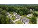 Aerial view of a well-maintained neighborhood showcasing manicured lawns and tree-lined streets, promoting community at 4395 Capstone Court, Roswell, GA 30075