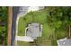 Bird's-eye view of a home with a manicured lawn, a long driveway, and a private backyard at 4395 Capstone Court, Roswell, GA 30075