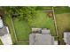 Aerial view of a large, fenced backyard with a playset at 4395 Capstone Court, Roswell, GA 30075