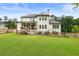 Expansive backyard view featuring a patio, garden, and lush green lawn, perfect for outdoor enjoyment at 4395 Capstone Court, Roswell, GA 30075