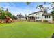 Picturesque backyard with lush lawn, fenced perimeter, and a playset, ideal for Gathering activities at 4395 Capstone Court, Roswell, GA 30075
