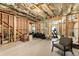 Unfinished basement featuring exposed ceiling and framing, offering room for potential customization and expansion at 4395 Capstone Court, Roswell, GA 30075