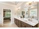 Modern bathroom featuring double vanities, granite countertops, and an elegant soaking tub at 4395 Capstone Court, Roswell, GA 30075