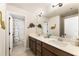 Bathroom features double sinks with modern fixtures, tiled floors, and lots of storage at 4395 Capstone Court, Roswell, GA 30075