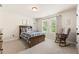 Comfortable bedroom featuring a rocking chair and wooden furniture at 4395 Capstone Court, Roswell, GA 30075
