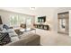Bonus room featuring a large sectional, media center, and plenty of natural light at 4395 Capstone Court, Roswell, GA 30075