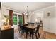 Dining room with hardwood floors, natural light from large windows, wainscoting, and chandelier at 4395 Capstone Court, Roswell, GA 30075