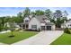 Beautiful home with a long driveway leading to an attached two-car garage at 4395 Capstone Court, Roswell, GA 30075