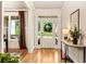 Bright foyer featuring hardwood floors, white trim, front door with sidelights and a view to the front yard at 4395 Capstone Court, Roswell, GA 30075