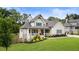 Charming home with a welcoming front porch and well-manicured landscaping adding to its curb appeal at 4395 Capstone Court, Roswell, GA 30075