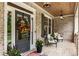 Cozy front porch with brick flooring, comfortable seating, and a charming entrance at 4395 Capstone Court, Roswell, GA 30075