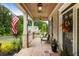 Inviting front porch with brick flooring, pendant lighting, and comfortable seating at 4395 Capstone Court, Roswell, GA 30075