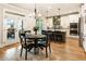 Eat-in kitchen with stainless appliances, center island, and access to the deck at 4395 Capstone Court, Roswell, GA 30075