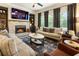 Comfortable living room with a brick fireplace and built-in shelving at 4395 Capstone Court, Roswell, GA 30075