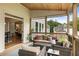 Covered patio with comfortable seating, a wood ceiling, and a view of the backyard at 4395 Capstone Court, Roswell, GA 30075
