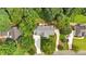 Aerial view of the home featuring mature trees, backyard patio area, and long driveway at 17 Sassafras Ne Trl, Cartersville, GA 30121