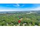 Aerial view of home nestled in a lush landscape with a red pin marking the property location at 17 Sassafras Ne Trl, Cartersville, GA 30121