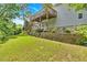 Multi-tiered backyard featuring a deck, patio, and stone retaining wall, perfect for outdoor living at 17 Sassafras Ne Trl, Cartersville, GA 30121