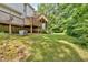Green backyard featuring a deck and stairs attached to the back of the house at 17 Sassafras Ne Trl, Cartersville, GA 30121