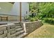 Well-maintained backyard with stone steps and a retaining wall, providing an attractive outdoor space at 17 Sassafras Ne Trl, Cartersville, GA 30121