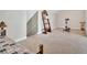 This carpeted bonus room features lots of space, good lighting, and neutral colored walls at 17 Sassafras Ne Trl, Cartersville, GA 30121