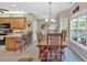 Spacious dining area with tile floors, natural light, and view into the kitchen at 17 Sassafras Ne Trl, Cartersville, GA 30121
