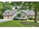 Charming home with a two-car garage, manicured lawn, and lush landscaping provides great curb appeal at 17 Sassafras Ne Trl, Cartersville, GA 30121