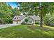 Charming home with a two-car garage, manicured lawn, and lush landscaping provides great curb appeal at 17 Sassafras Ne Trl, Cartersville, GA 30121