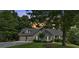 Well-maintained exterior of home with a two-car garage, mature trees and green lawn at 17 Sassafras Ne Trl, Cartersville, GA 30121
