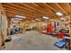 This massive garage features an auto lift, open rafters, lots of floor space, and a wall air conditioner at 17 Sassafras Ne Trl, Cartersville, GA 30121