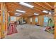 This massive garage features an auto lift, open rafters, lots of floor space, and a door to the outside at 17 Sassafras Ne Trl, Cartersville, GA 30121